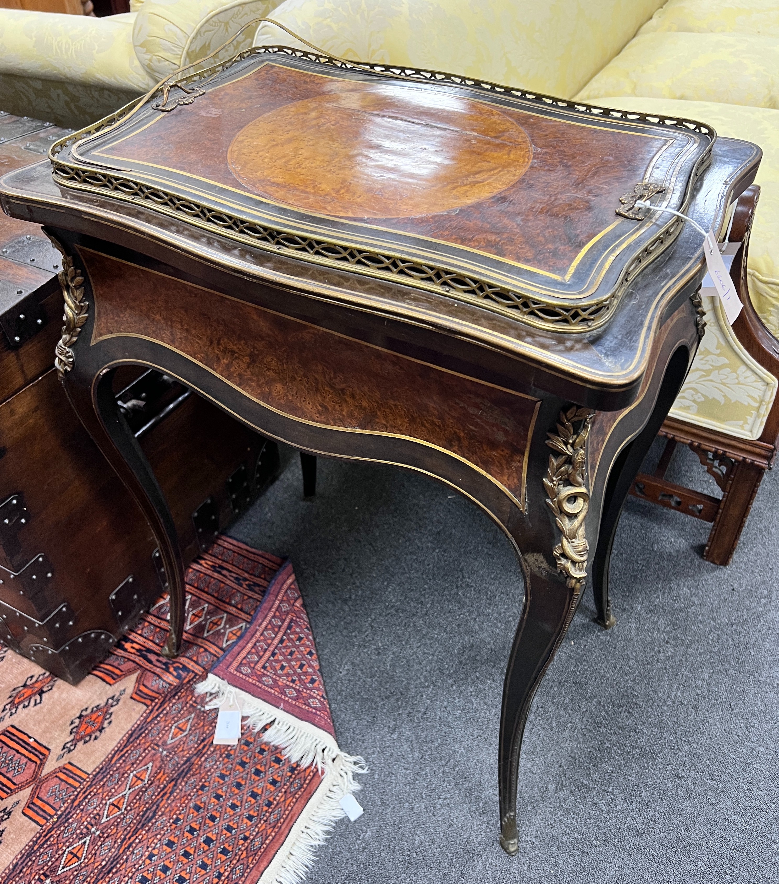 A 19th century gilt metal mounted birds eye maple and amboyna jardiniere table, bears Druce & Co paper label, width 60cm, depth 42cm, height 82cm